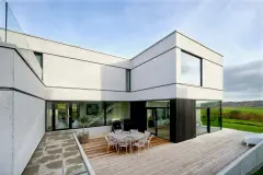 Einfamilienhaus kubistisch mit grauem Putz