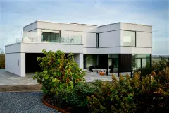 Einfamilienhaus kubistisch mit grauer Putzfassade